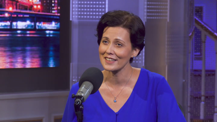 Kay Rubacek giving a news interview